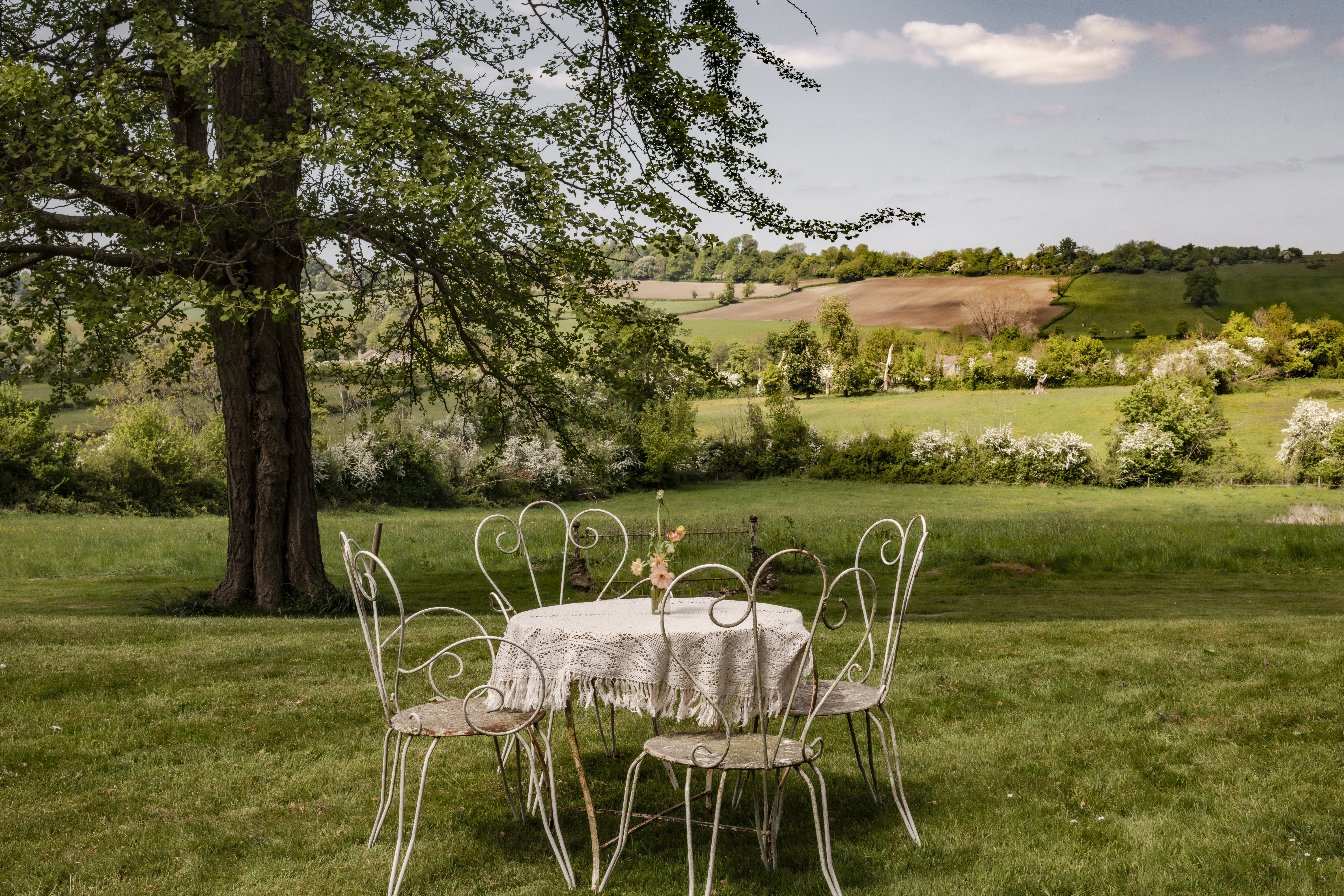 Stylish outdoor seating overlooking a beautiful landscape.